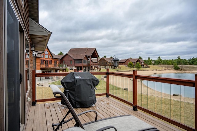 W5677 N Stone Gate Dr, New Lisbon, WI 53950 - wooden deck with a water view, a residential view, and grilling area