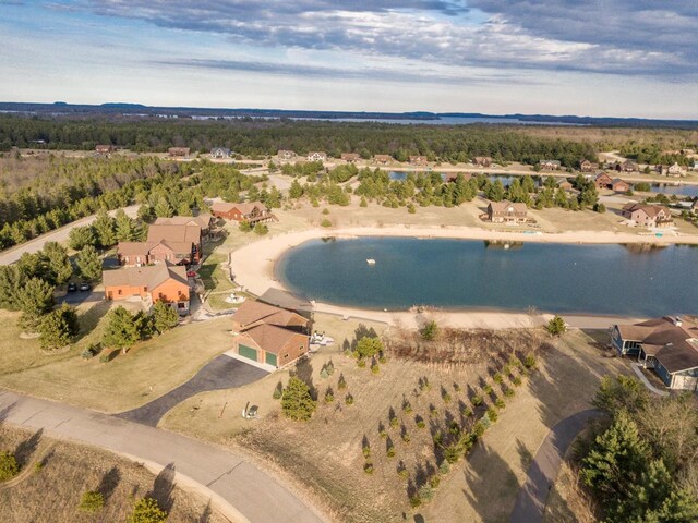 W5677 N Stone Gate Dr, New Lisbon, WI 53950 - drone / aerial view with a forest view, a residential view, and a water view