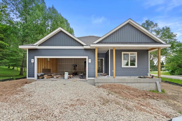 LT2 Steeple View Rd, West Bend, WI 53095 - view of front of house with a garage, a porch, board and batten siding, and a shingled roof