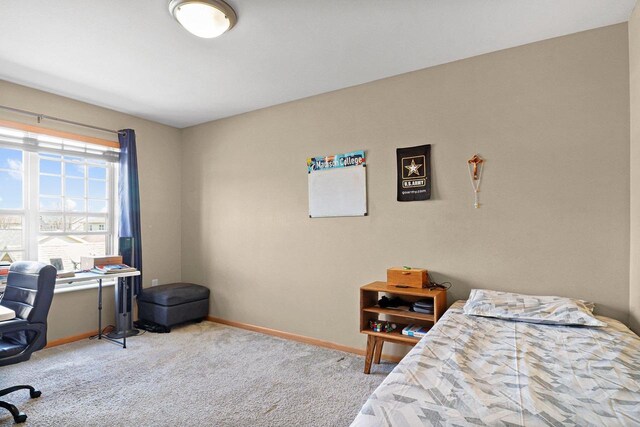 bedroom featuring carpet floors and baseboards