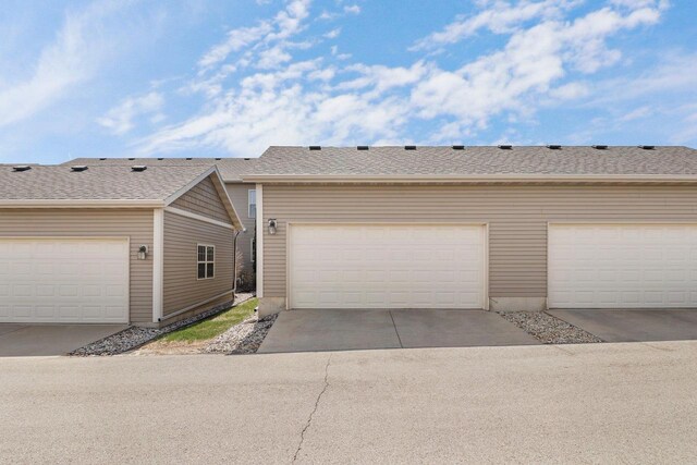 view of property exterior with community garages