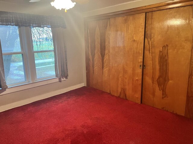 5169 Kratz Rd, Omro, WI 54963 - unfurnished bedroom with dark carpet and a closet