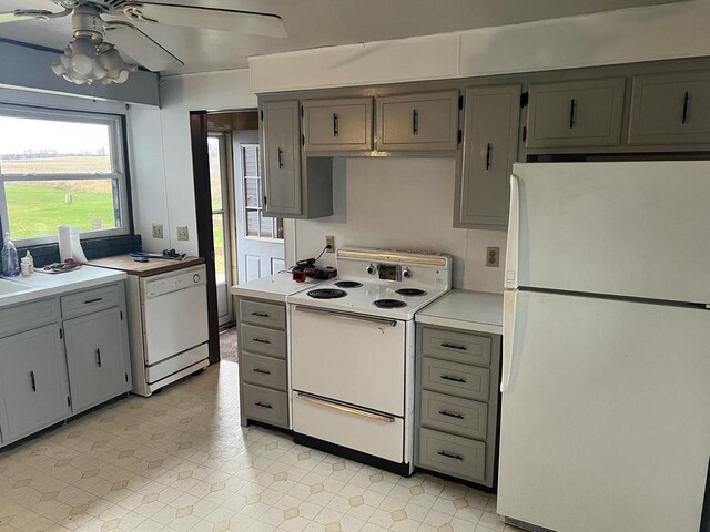 5169 Kratz Rd, Omro, WI 54963 - kitchen featuring gray cabinets, light countertops, a ceiling fan, and white appliances
