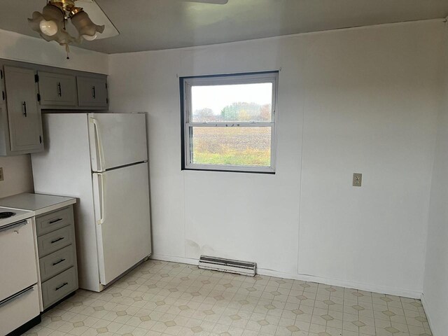 5169 Kratz Rd, Omro, WI 54963 - kitchen featuring white appliances, gray cabinetry, and light floors