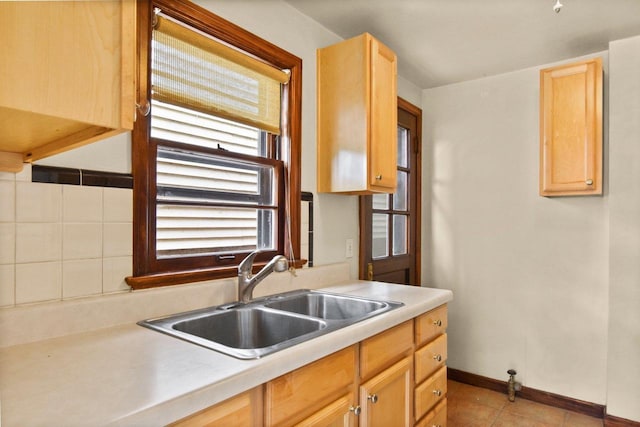 718 S Dickinson St, Madison, WI 53703 - kitchen with a sink, light countertops, and light brown cabinets