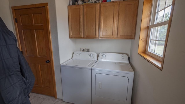 N302 24th Ave, Neshkoro, WI 54960 - washroom featuring washing machine and dryer, cabinet space, and light tile patterned flooring