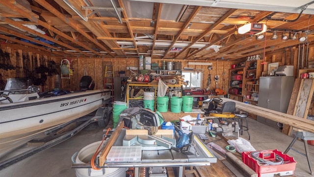 N302 24th Ave, Neshkoro, WI 54960 - garage featuring a garage door opener and a workshop area