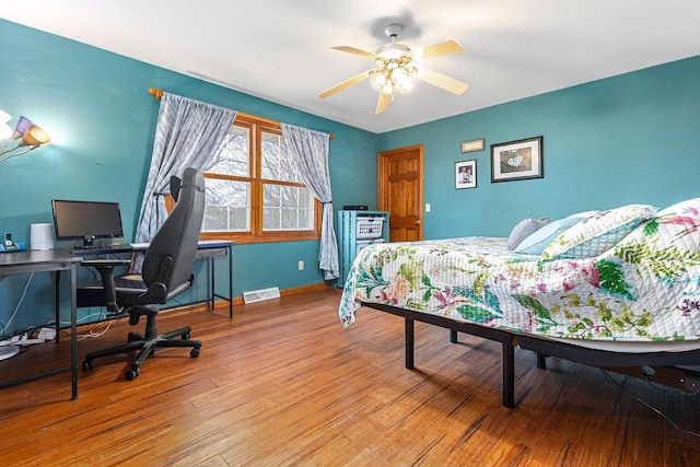101 Brookview Pl, Combined Locks, WI 54113 - bedroom with a desk, wood finished floors, and a ceiling fan