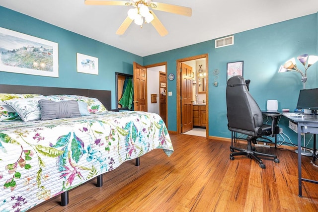101 Brookview Pl, Combined Locks, WI 54113 - bedroom featuring wood finished floors, ceiling fan, and connected bathroom