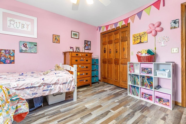 101 Brookview Pl, Combined Locks, WI 54113 - bedroom featuring wood finished floors, a closet, and ceiling fan