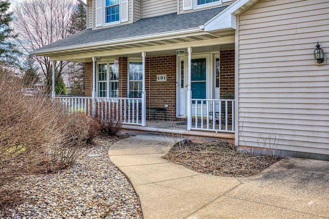 101 Brookview Pl, Combined Locks, WI 54113 - entrance to property with a porch, a shingled roof, and brick siding