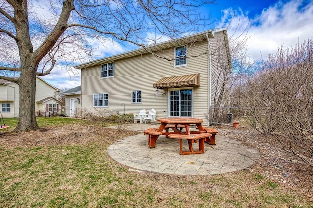 101 Brookview Pl, Combined Locks, WI 54113 - rear view of house featuring a patio area and a lawn