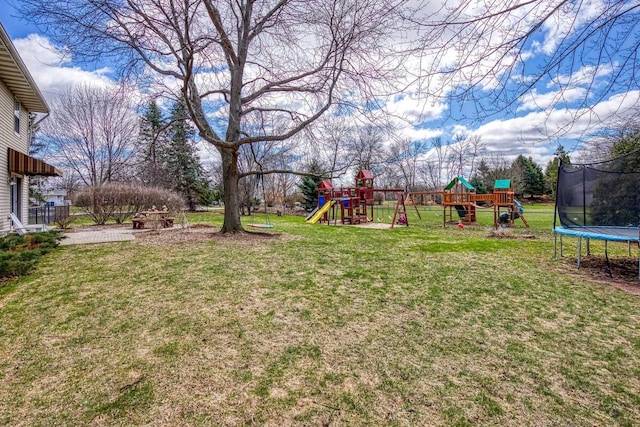 101 Brookview Pl, Combined Locks, WI 54113 - view of grassy yard with a trampoline and a playground