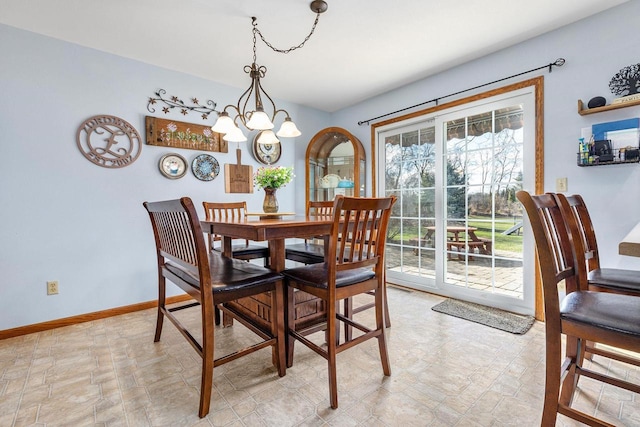 101 Brookview Pl, Combined Locks, WI 54113 - dining area with a chandelier and stone finish floors