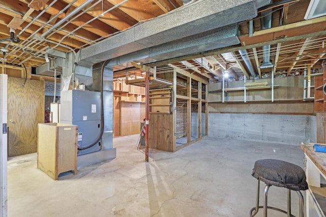 unfinished below grade area featuring heating unit