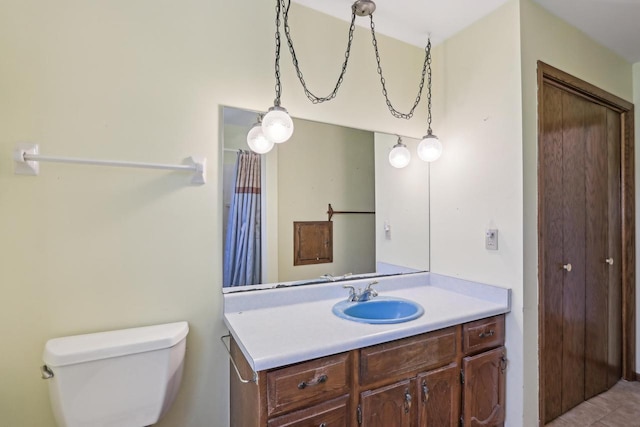 bathroom with toilet and vanity