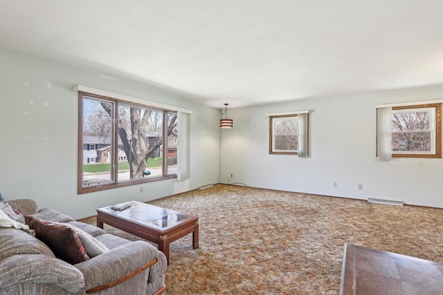 living room featuring visible vents, carpet floors, and plenty of natural light