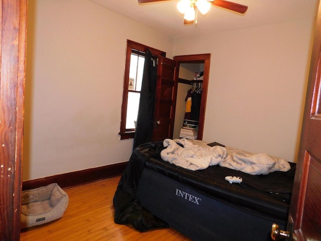 4058 N 7th St, Milwaukee, WI 53209 - bedroom featuring a closet, ceiling fan, wood finished floors, and baseboards
