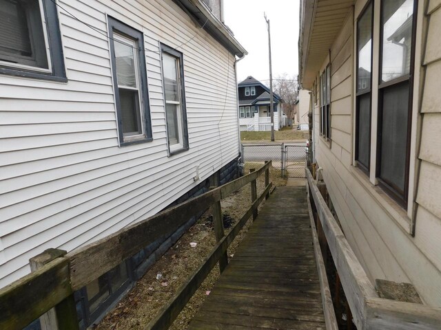 4058 N 7th St, Milwaukee, WI 53209 - view of side of home featuring fence and a gate
