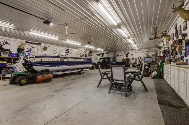 2984 Weirgor Rd, Exeland, WI 54835 - garage with a workshop area and a garage door opener