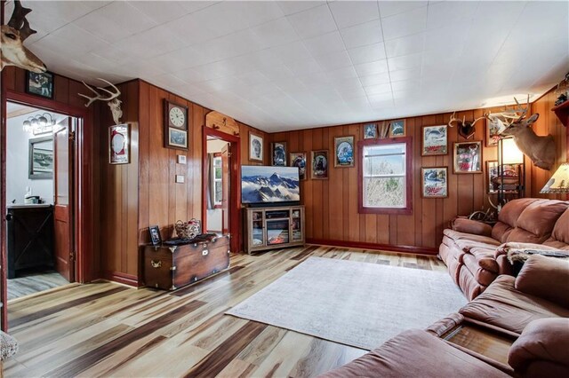 2984 Weirgor Rd, Exeland, WI 54835 - living room with wooden walls and wood finished floors