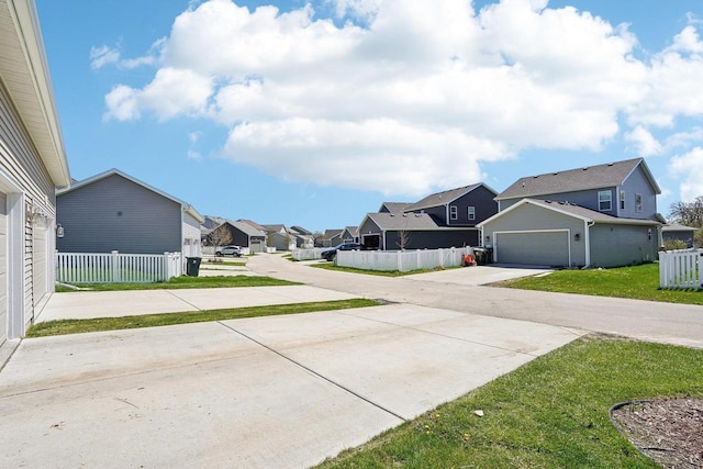 1059 Okeeffe Ave, Sun Prairie, WI 53590 - view of concrete driveway with a residential view