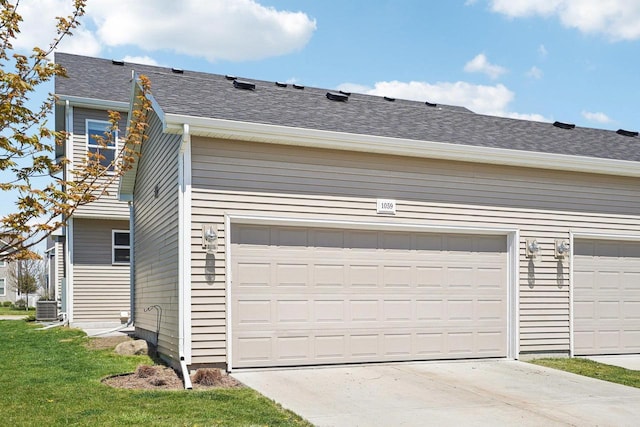 1059 Okeeffe Ave, Sun Prairie, WI 53590 - garage featuring driveway and central air condition unit