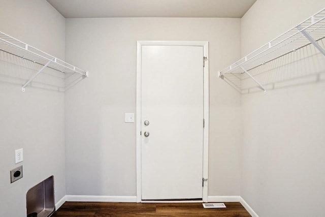 1059 Okeeffe Ave, Sun Prairie, WI 53590 - washroom with electric dryer hookup, dark wood-style floors, and baseboards