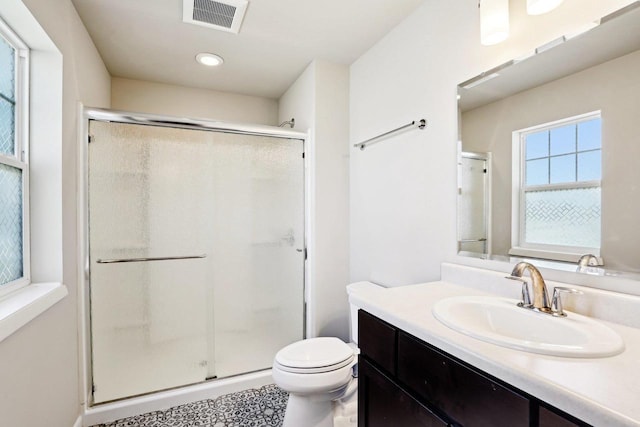 1059 Okeeffe Ave, Sun Prairie, WI 53590 - full bath with a stall shower, toilet, vanity, and recessed lighting