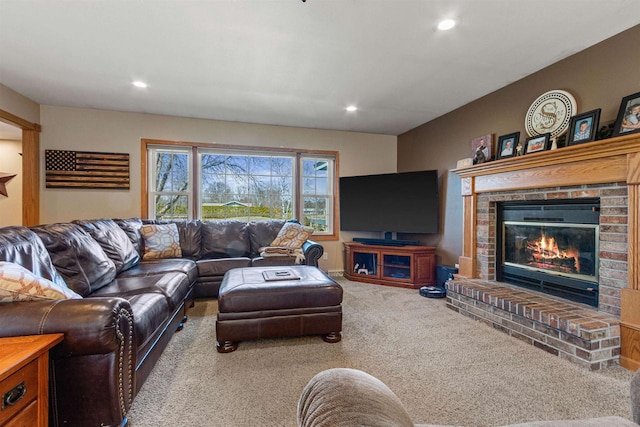 living area featuring recessed lighting, carpet, and a fireplace