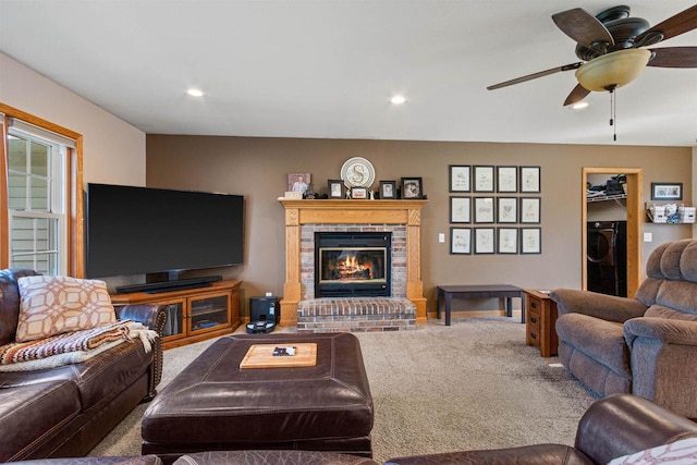 carpeted living room with recessed lighting, washer / clothes dryer, a ceiling fan, and a fireplace