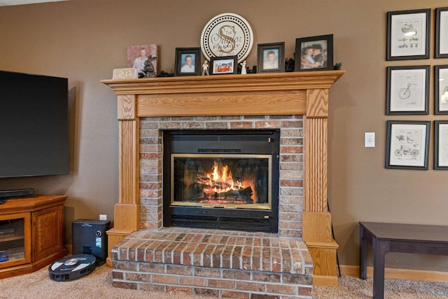 details featuring a fireplace and carpet floors