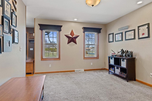 interior space with baseboards, visible vents, and recessed lighting
