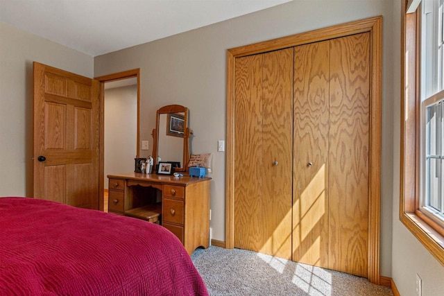 bedroom featuring baseboards and carpet flooring
