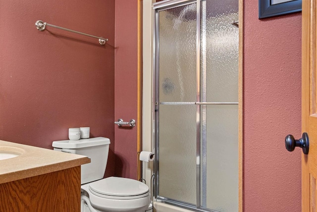 full bathroom featuring a textured wall and a stall shower