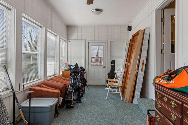 sunroom / solarium with carpet floors and plenty of natural light
