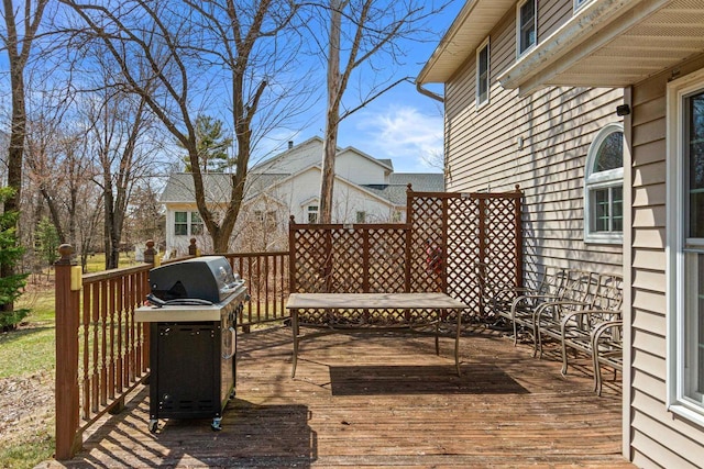 wooden terrace featuring grilling area
