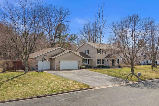 view of front facade featuring an attached garage, a front lawn, fence, and aphalt driveway