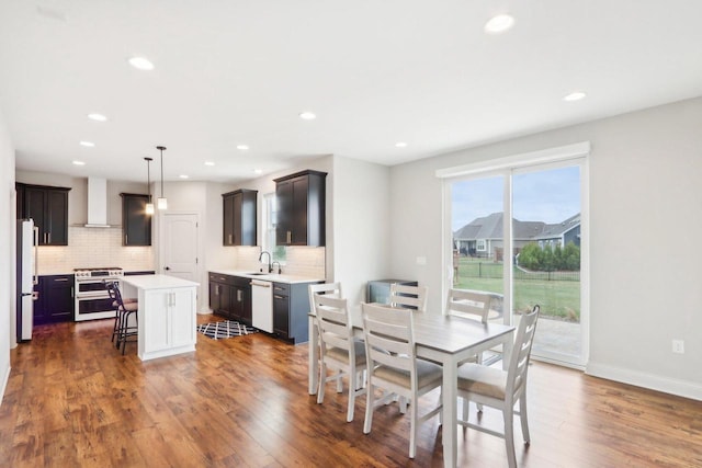 1520 Fay Ln, Oconomowoc, WI 53066 - dining room with dark wood finished floors, baseboards, and recessed lighting