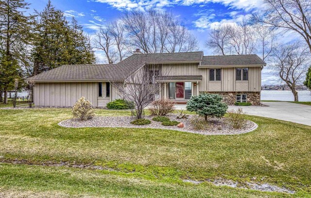 2151 Sunrise Dr, Appleton, WI 54914 - split level home with a shingled roof, a front lawn, a chimney, and concrete driveway