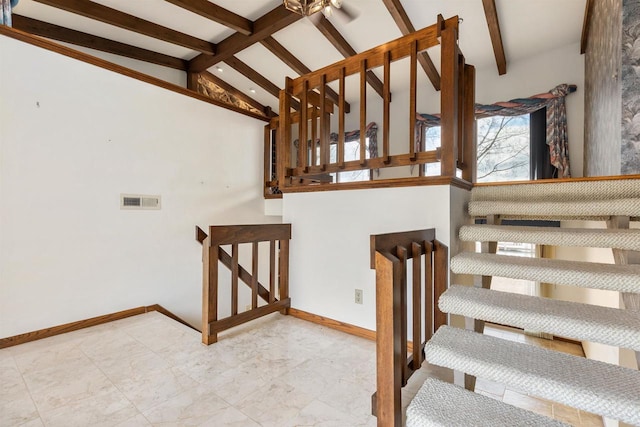2151 Sunrise Dr, Appleton, WI 54914 - stairway with marble finish floor, baseboards, vaulted ceiling with beams, and visible vents