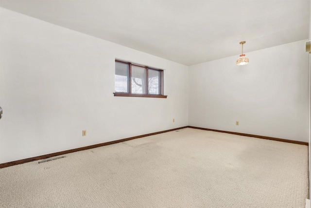 2151 Sunrise Dr, Appleton, WI 54914 - empty room featuring light colored carpet, baseboards, and visible vents