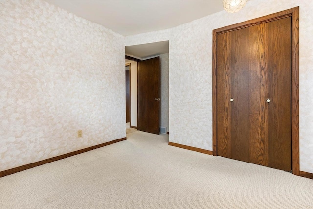 2151 Sunrise Dr, Appleton, WI 54914 - unfurnished bedroom with baseboards, a closet, and light colored carpet