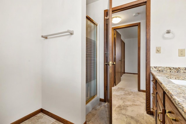 2151 Sunrise Dr, Appleton, WI 54914 - bathroom with a shower stall, baseboards, and vanity