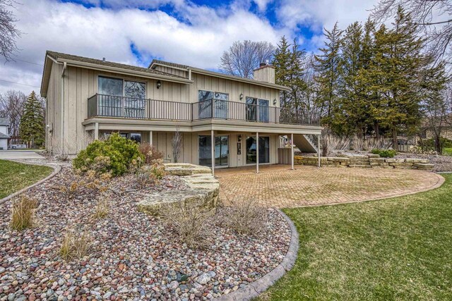 2151 Sunrise Dr, Appleton, WI 54914 - rear view of property with a chimney and a lawn