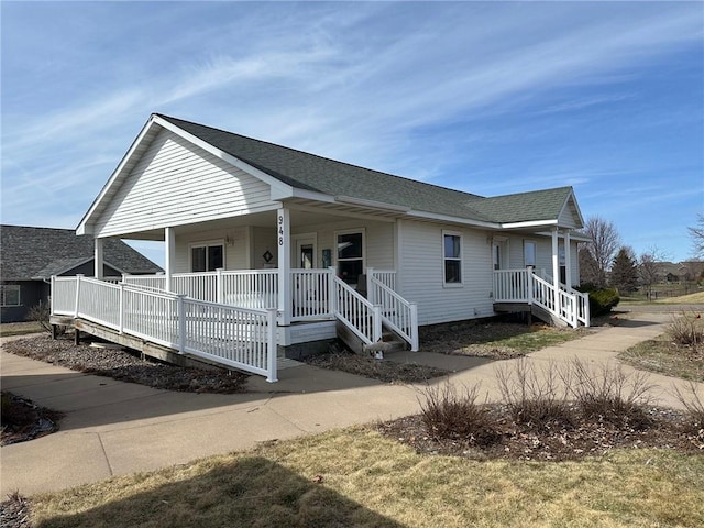 948 Wissota Green Pkwy, Chippewa Falls, WI 54729 - view of front of house with roof with shingles and covered porch