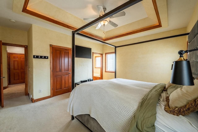 201 E Clearfield Ln, Appleton, WI 54913 - bedroom with light carpet, a tray ceiling, baseboards, and ceiling fan