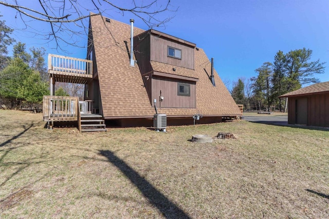317 Darby Ct, Nekoosa, WI 54457 - back of house featuring central AC, a wooden deck, a shingled roof, a balcony, and a yard