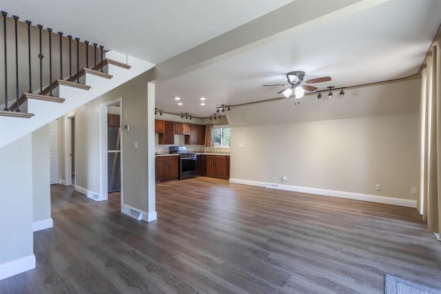 317 Darby Ct, Nekoosa, WI 54457 - unfurnished living room with baseboards, track lighting, dark wood-style floors, and ceiling fan