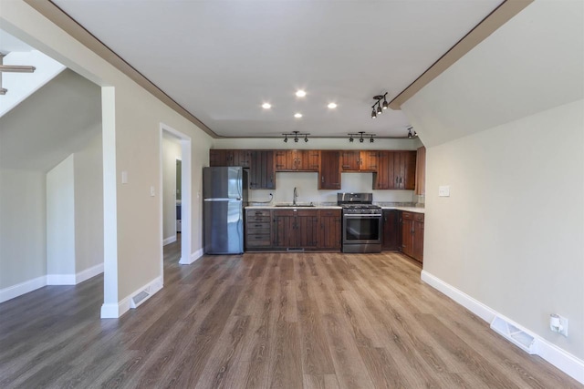 317 Darby Ct, Nekoosa, WI 54457 - kitchen with stainless steel appliances, track lighting, a sink, visible vents, and light countertops